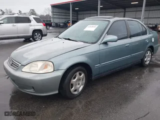1999 Honda Civic EX with VIN 1HGEJ8643XL010821, listed as a IAAI auction lot 41602036 with 165,139 mi miles. Bid and sale history available at carsss.com. Image 2.