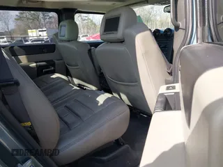 2005 Hummer H2 SUT with VIN 5GRGN22U15H114401, listed as a IAAI auction lot 41268764 with 166,651 mi miles. Bid and sale history available at carsss.com. Image 8.