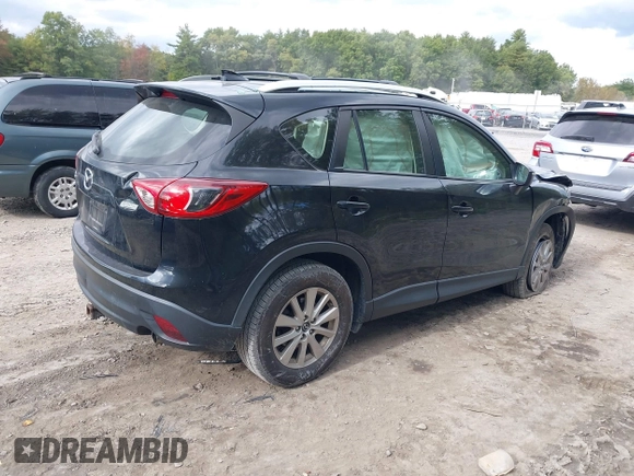 2016 Mazda CX-5 Sport with VIN JM3KE2BE8G0804398, listed as a IAAI auction lot 40490953 with 116,279 mi miles and . Bid and sale history available at DreamBid. Image 4.