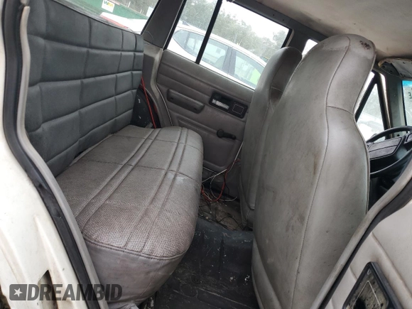 1996 Jeep Cherokee SE z VIN 1J4FJ28S7TL256478, wystawiony jako Copart lot #47164985 z przebiegiem 195 800 mil mil oraz Nie do naprawy • Non repairable. Historia ofert i sprzedaży dostępna na DreamBid. Obrazek 10.