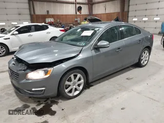 2016 Volvo S60 T5 Premier z VIN YV1612TK0G2410743, wystawiony jako IAAI lot #41717318 z przebiegiem 87 087 mil mil oraz . Historia ofert i sprzedaży dostępna na DreamBid. Obrazek 17.