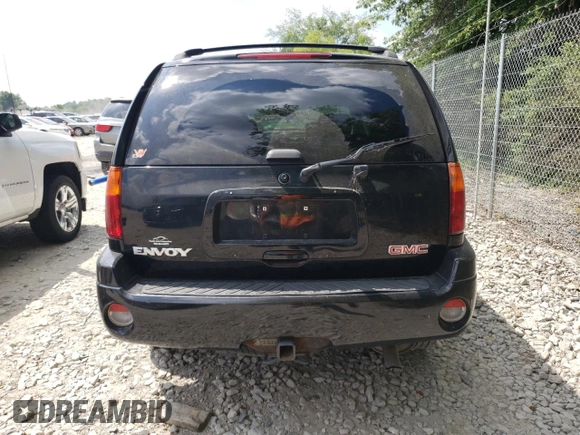 2004 GMC Envoy SLT with VIN 1GKDT13S042281050, listed as a Copart auction lot 60024304 with 267,205 mi miles and Salvage Title. Bid and sale history available at carsss.com. Image 6.