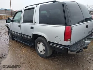 1997 Chevrolet Tahoe with VIN 1GNEK13R0VJ351919, listed as a IAAI auction lot 41028840 with 218,937 mi miles. Bid and sale history available at carsss.com. Image 3.