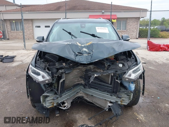 2018 Chevrolet Traverse Premier z VIN 1GNEVJKW4JJ240024, wystawiony jako IAAI lot #42369659 z przebiegiem 160 147 mil mil oraz . Historia ofert i sprzedaży dostępna na DreamBid. Obrazek 13.