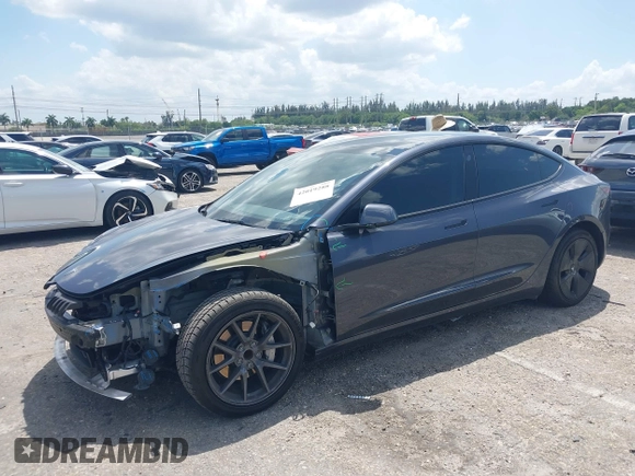 2023 Tesla Model 3 with VIN 5YJ3E1EAXPF575448, listed as a IAAI auction lot 42019288 with 33,859 mi miles and . Bid and sale history available at carsss.com. Image 18.