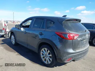 2014 Mazda CX-5 Grand Touring with VIN JM3KE4DY1E0364685, listed as a IAAI auction lot 41665349 with 135,751 mi miles. Bid and sale history available at carsss.com. Image 3.