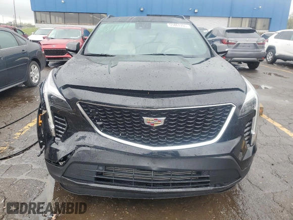 2022 Cadillac XT4 AWD Sport с VIN 1GYFZFR46NF170841, выставлен на аукционе Copart как лот 55863705 с пробегом 14 745 миль миль и Списание • Salvage title. История ставок и продаж доступна на DreamBid. Изображение 5.