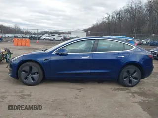 2019 Tesla Model 3 Mid Range with VIN 5YJ3E1EA5KF299589, listed as a IAAI auction lot 41709733 with 50,256 mi miles and . Bid and sale history available at DreamBid. Image 15.