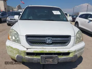2003 Honda Pilot EX with VIN 2HKYF18583H537259, listed as a IAAI auction lot 42170726 with 319,752 mi miles and . Bid and sale history available at carsss.com. Image 6.