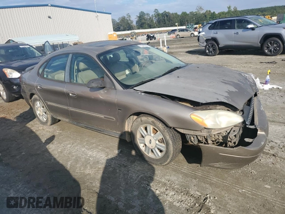 2003 Ford Taurus SEL Deluxe with VIN 1FAHP56SX3A243775, listed as a Copart auction lot 72245394 with 251,041 mi miles and Salvage Title. Bid and sale history available at DreamBid. Image 4.