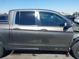 2022 Honda Ridgeline RTL with VIN 5FPYK3F58NB007618, listed as a IAAI auction lot 42258443 with 14,036 mi miles and . Bid and sale history available at DreamBid. Image 14.