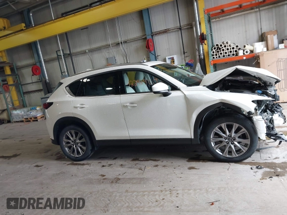 2020 Mazda CX-5 Grand Touring with VIN JM3KFADMXL0742038, listed as a IAAI auction lot 42292400 with 68,339 mi miles and . Bid and sale history available at DreamBid. Image 14.