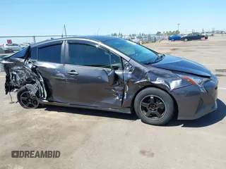 2016 Toyota Prius Two z VIN JTDKBRFU1G3521884, wystawiony jako IAAI lot #42081852 z przebiegiem 93 107 mil mil oraz . Historia ofert i sprzedaży dostępna na DreamBid. Obrazek 13.