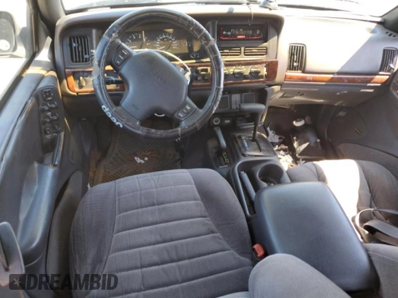 1997 Jeep Grand Cherokee Laredo with VIN 1J4GZ58S7VC505069, listed as a Copart auction lot 63255945 with 127,552 mi miles and Salvage title. Bid and sale history available at DreamBid. Image 8.