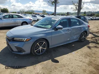 2023 Honda Civic Touring z VIN 2HGFE1F91PH303061, wystawiony jako Copart lot #51800295 z przebiegiem 14 488 mil mil oraz Szkoda całkowita • Salvage title. Historia ofert i sprzedaży dostępna na DreamBid. Obrazek 1.