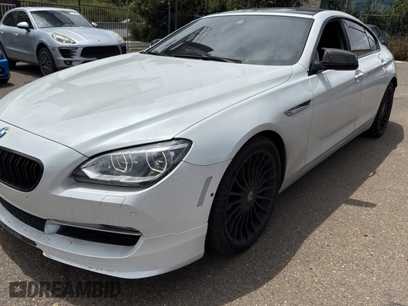 2015 BMW 6 Series 650i xDrive with VIN WBA6B4C57FD899926, listed as a Copart auction lot 54974505 with 63,570 mi miles and Salvage Title. Bid and sale history available at carsss.com. Image 2.