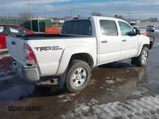 2014 Toyota Tacoma with VIN 3TMLU4ENXEM134872, listed as a IAAI auction lot 41303669 with 167,548 mi miles. Bid and sale history available at carsss.com. Image 4.