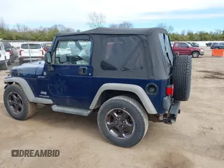 2005 Jeep Wrangler Sport with VIN 1J4FA49S05P384308, listed as a IAAI auction lot 41821354 with 106,394 mi miles. Bid and sale history available at carsss.com. Image 14.