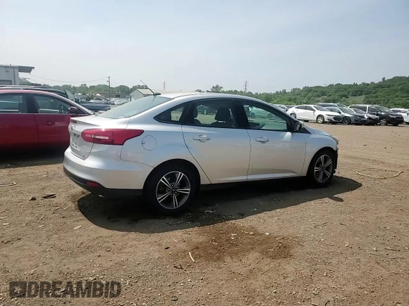 2017 Ford Focus SE with VIN 1FADP3FE7HL290271, listed as a Copart auction lot 60665615 with 130,409 mi miles and Salvage title. Bid and sale history available at DreamBid. Image 14.
