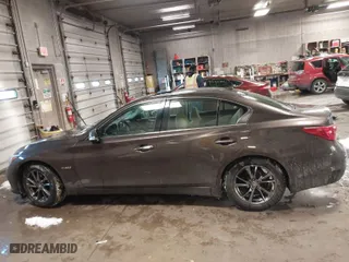 2014 Infiniti Q50 Hybrid Premium with VIN JN1AV7AR3EM702182, listed as a IAAI auction lot 41577667 with 61,599 mi miles. Bid and sale history available at carsss.com. Image 14.