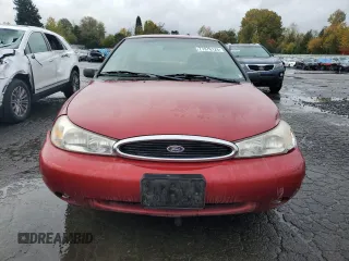 2000 Ford Contour SE Fleet z VIN 1FAFP6636YK142708, wystawiony jako Copart lot #77976124 z przebiegiem 126 879 mil mil oraz Szkody całkowita. Historia ofert i sprzedaży dostępna na DreamBid. Obrazek 5.