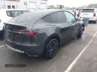 2025 Tesla Model Y Long Range with VIN 7SAYGDED8SA340082, listed as a IAAI auction lot 41915369 with 7,296 mi miles and . Bid and sale history available at carsss.com. Image 4.