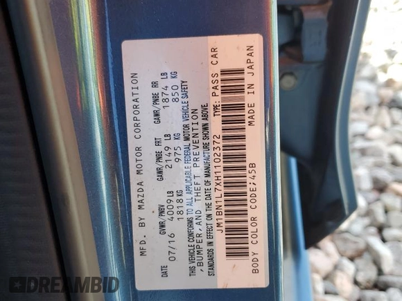2017 Mazda 3 Touring z VIN JM1BN1L7XH1102372, wystawiony jako Copart lot #61180195 z przebiegiem 57 606 mil mil oraz Szkoda całkowita • Salvage title. Historia ofert i sprzedaży dostępna na DreamBid. Obrazek 13.