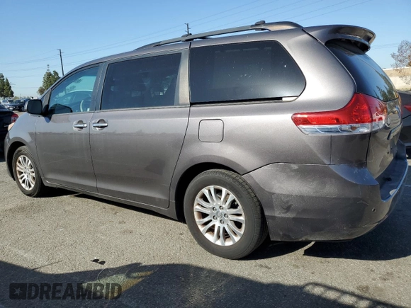 2013 Toyota Sienna XLE AAS with VIN 5TDYK3DC8DS323329, listed as a Copart auction lot 51957005 with 157,638 mi miles and Salvage title. Bid and sale history available at DreamBid. Image 2.