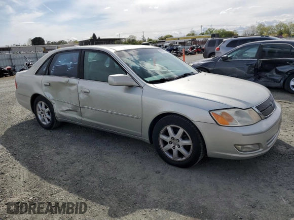 2000 Toyota Avalon XL with VIN 4T1BF28B3YU002835, listed as a Copart auction lot 50902115 with 128,699 mi miles and Salvage Title. Bid and sale history available at DreamBid. Image 4.