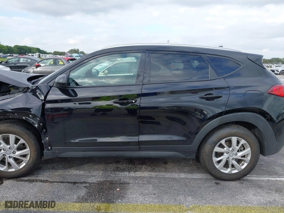 2019 Hyundai Tucson Value with VIN KM8J33A40KU068014, listed as a IAAI auction lot 40877057 with 34,966 mi miles. Bid and sale history available at carsss.com. Image 14.