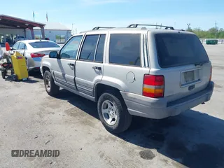 1996 Jeep Grand Cherokee Laredo with VIN 1J4FX58S2TC397006, listed as a IAAI auction lot 41836108 with 136,742 mi miles. Bid and sale history available at carsss.com. Image 3.