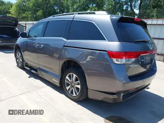 2015 Honda Odyssey Touring Elite z VIN 5FNRL5H99FB017517, wystawiony jako IAAI lot #42246066 z przebiegiem 104 878 mil mil oraz . Historia ofert i sprzedaży dostępna na DreamBid. Obrazek 3.