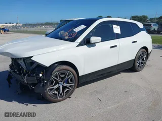 2025 BMW iX xDrive50 with VIN WB523CF02SCT10334, listed as a IAAI auction lot 40396663 with 971 mi miles. Bid and sale history available at carsss.com. Image 2.