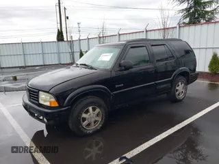 1999 Oldsmobile Bravada z VIN 1GHDT13W0X2712225, wystawiony jako IAAI lot #41550117 z przebiegiem 170 706 mil mil oraz . Historia ofert i sprzedaży dostępna na DreamBid. Obrazek 2.