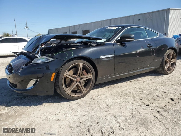 2015 Jaguar XK with VIN SAJWA4DCXFMB55227, listed as a Copart auction lot 48455465 with 64,050 mi miles and Salvage Title. Bid and sale history available at carsss.com. Image 1.