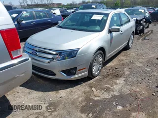 2010 Ford Fusion Hybrid z VIN 3FADP0L38AR411074, wystawiony jako IAAI lot #41928348 z przebiegiem 79 306 mil mil oraz . Historia ofert i sprzedaży dostępna na DreamBid. Obrazek 6.