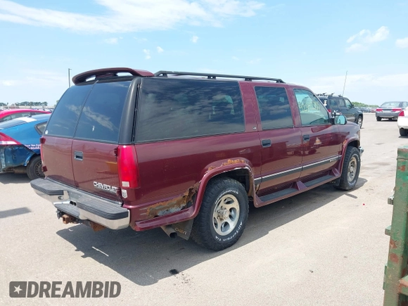 1999 Chevrolet Suburban with VIN 1GBFK16R5XJ335005, listed as a IAAI auction lot 42542755 with 200,599 mi miles and . Bid and sale history available at DreamBid. Image 4.