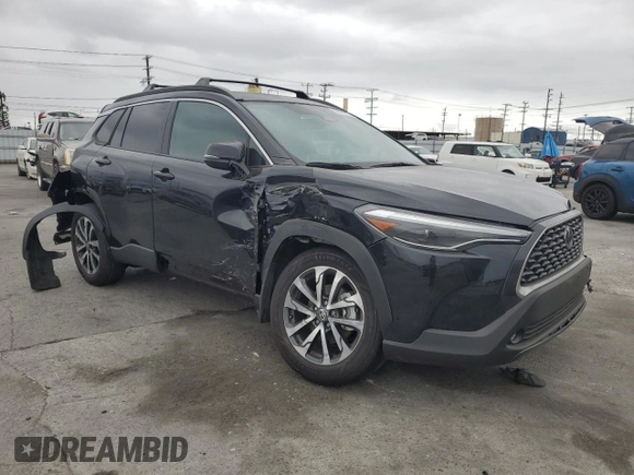 2024 Toyota Corolla Cross XLE with VIN 7MUDAAAG8RV095021, listed as a Copart auction lot 59232265 with 7,010 mi miles and Salvage title. Bid and sale history available at DreamBid. Image 4.