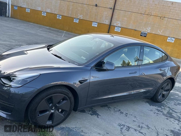 2023 Tesla Model 3 with VIN 5YJ3E1EA1PF607137, listed as a Copart auction lot 62613375 with 27,271 mi miles and Clean title. Bid and sale history available at DreamBid. Image 2.