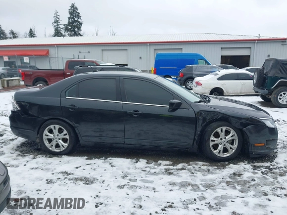 2012 Ford Fusion SE z VIN 3FAHP0HG2CR323380, wystawiony jako IAAI lot #41543660 z przebiegiem 169 059 mil mil oraz . Historia ofert i sprzedaży dostępna na DreamBid. Obrazek 13.