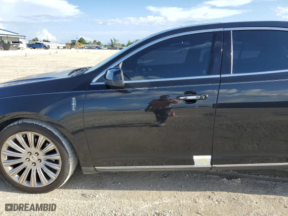 2014 Lincoln MKS with VIN 1LNHL9EK6EG604428, listed as a Copart auction lot 59758884 with 122,833 mi miles and Salvage Title. Bid and sale history available at carsss.com. Image 14.