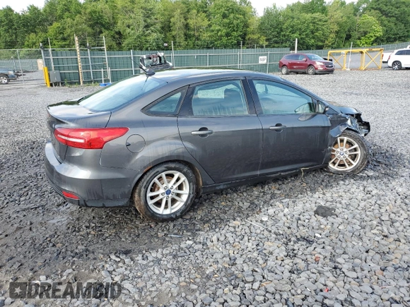 2016 Ford Focus SE z VIN 1FADP3F24GL313333, wystawiony jako Copart lot #60023715 z przebiegiem Nie podano mil oraz Szkoda całkowita • Salvage title. Historia ofert i sprzedaży dostępna na DreamBid. Obrazek 3.