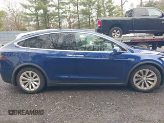 2016 Tesla Model X 70D with VIN 5YJXCBE20GF016173, listed as a IAAI auction lot 41809725 with 116,198 mi miles. Bid and sale history available at carsss.com. Image 13.
