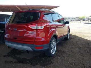 2013 Ford Escape Titanium with VIN 1FMCU0J96DUB08681, listed as a IAAI auction lot 42068864 with 102,094 mi miles and . Bid and sale history available at carsss.com. Image 4.