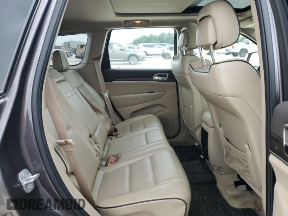 2014 Jeep Grand Cherokee Overland with VIN 1C4RJFCG9EC572237, listed as a Copart auction lot 53864865 with 90,657 mi miles and Salvage Title. Bid and sale history available at DreamBid. Image 11.