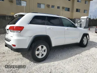 2016 Jeep Grand Cherokee Laredo z VIN 1C4RJEAG6GC390768, wystawiony jako Copart lot #51459885 z przebiegiem 130 690 mil mil oraz Szkoda całkowita • Salvage title. Historia ofert i sprzedaży dostępna na DreamBid. Obrazek 3.