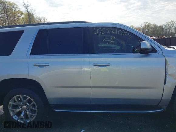 2015 GMC Yukon SLE with VIN 1GKS1AKC8FR540627, listed as a IAAI auction lot 42004023 with 128,195 mi miles. Bid and sale history available at carsss.com. Image 13.