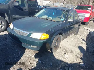 2000 Mazda Protege DX with VIN JM1BJ2229Y0235881, listed as a IAAI auction lot 41484779 with 283,054 mi miles and . Bid and sale history available at DreamBid. Image 2.
