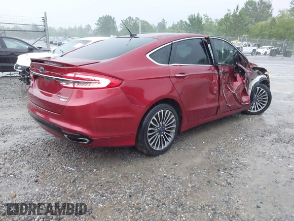 2018 Ford Fusion Titanium with VIN 3FA6P0D91JR233679, listed as a IAAI auction lot 42182140 with 100,706 mi miles and . Bid and sale history available at DreamBid. Image 4.