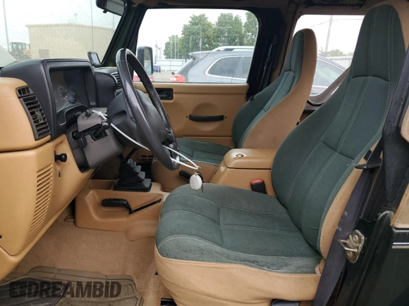 1998 Jeep Wrangler Sahara with VIN 1J4FY49S2WP707318, listed as a Copart auction lot 59508635 with 144,948 mi miles and Clean title. Bid and sale history available at DreamBid. Image 7.